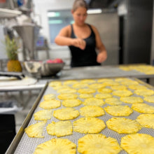 Load image into Gallery viewer, Tiny Maui Gold pineapples going in the dehydrator. These will be in our Maui-Ritas, Haleakala Sunsets, and whatever new flavor we are working on.
