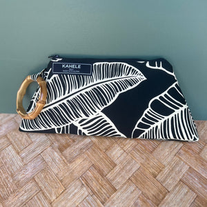 Bamboo bracelet Wristlet with cream color banana leaf print on a black background.